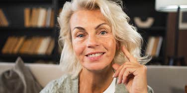 middle aged woman smiling from learning life lessons growing up