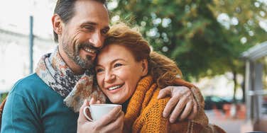 happy man sitting next to wife smiling