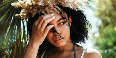 Pensive woman reflects on the painful truths, after getting burned in relationship.