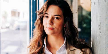 Successful business person looking pensive, symbolizing the hidden mindset trap that keeps high achievers stuck and how to break free