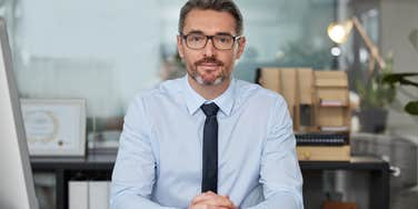 businessman sitting at desk for interview