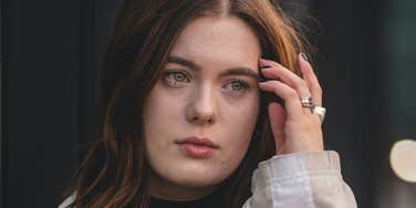 Woman moves forward from old wounds.