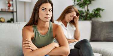 People Use These Phrases When They Are Majorly Annoyed With Their Parents adult woman annoyed with mom turned away from her
