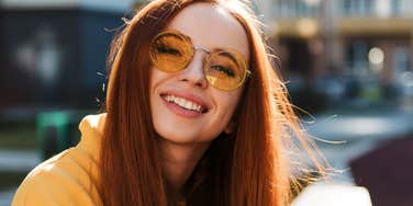 smiling young woman who thrives in chaos