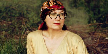 Woman looking off to the side in deep reflection, capturing the emotional regrets people feel when a marriage they believed would last forever begins to fall apart.