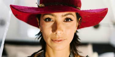 Intuitive woman with a dreamy spiritual expression showing the signs you might be a rare starseed person