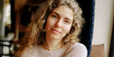 A good wife smiling because she's naturally grateful 