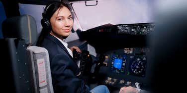 female pilot in plane cockpit