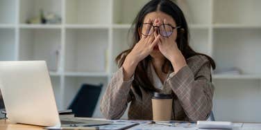 woman feeling tired at work