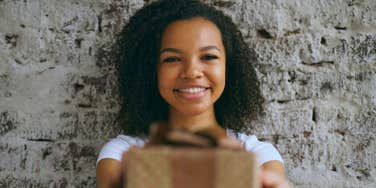 Daughter gives parents gift.