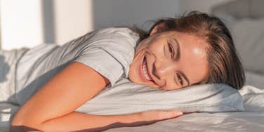 happy woman with common sense waking up for her morning routine