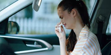 woman crying in her car after Ulta employee insulted her