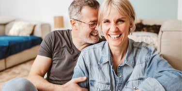 man still obsessed with his wife hugging her