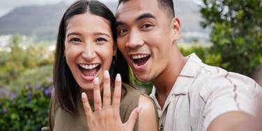 engaged couple showing off ring