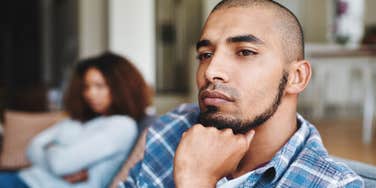 husband quietly falling out of love with wife turned away from her