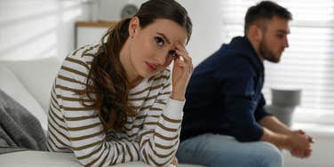 wife who feels taken for granted sitting with aloof husband