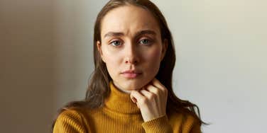 emotionally exhausted woman withdrawing looking sad