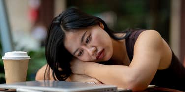 young woman with a lot weighing on her