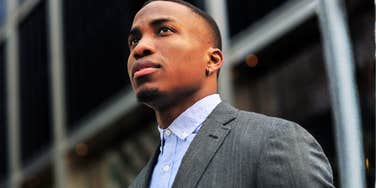 focused forward-looking person gazing toward the horizon with quiet confidence, illustrating the simple habits that make natural visionaries stand out and see what others miss