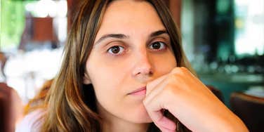 heartbroken person finding calm clarity while repeating gentle healing phrases, illustrating the simple language that helps people get over heartbreak faster