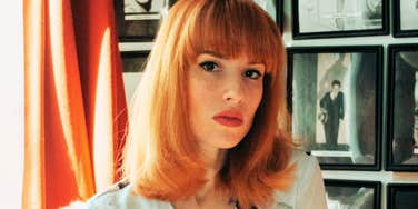 calm person pausing and breathing steadily during a tense moment, illustrating emotional control when things go wrong