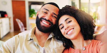 couple sharing a warm playful moment with easy chemistry, illustrating the simple everyday habits that keep a relationship feeling radiant and alive