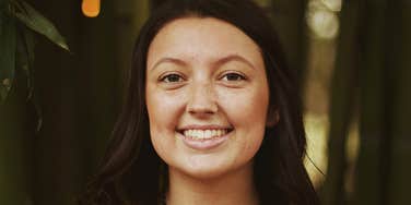 Woman is happy and unbothered.