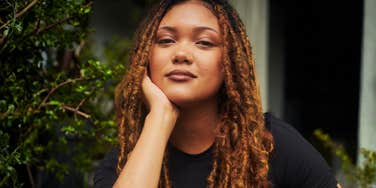 Woman sitting in a quiet reflective moment showing the subtle reasons a marriage might still work before you decide to leave.