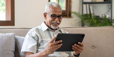 elderly man on tablet