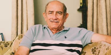 elderly person sitting in quiet reflection with calm clarity and fulfillment, illustrating Carl Jung’s idea of what defines an exceptionally successful life by seventy