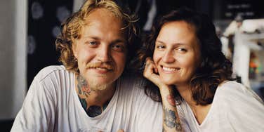 A couple sitting next to each other and refusing to give up on their relationship 