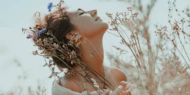 happy woman outside who knows her true self