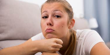woman who is an only child feeling sad about her upbringing
