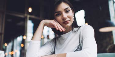 woman with unusually high intelligence smiling while doing work