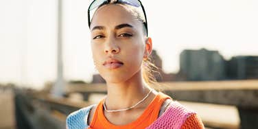 young adult woman staring off serious