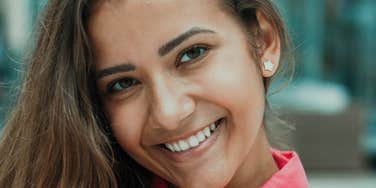 Woman is happy and unbothered.