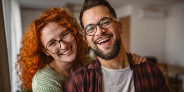 good man smiling next to his happy wife
