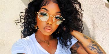 confident content person standing open and relaxed with a sense of readiness, illustrating the subtle signs someone is emotionally prepared to share life with a healthy, meaningful partner