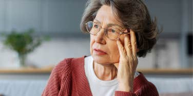 sad older woman feeling lonely at home