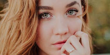 Woman lets someone down gently.