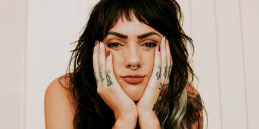 heartbroken person sitting alone, capturing the painful truths that surface when you love someone who refuses to commit