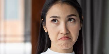 immature woman rolling her eyes acting childish