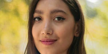 Unbothered woman has morning habits.