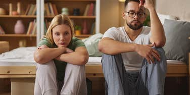 emotionally distant couple sitting next to each other