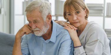 sad senior couple not doing great at home