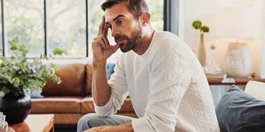 frugal man having regrets about how hes lived his life