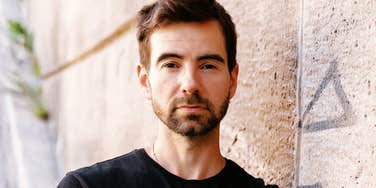 People With Sociopathic Traits Blend In Well — But These Signs Always Out Them calm expressionless person giving an unreadable stare, capturing the subtle tells that expose people with sociopathic traits even when they blend in perfectly