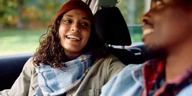 Woman who turned her crush into love sitting with him in a car