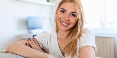 People Who Were Raised Right Say These Things Naturally smiling woman who was raised right by her parents