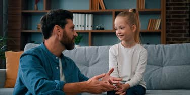 dad explaining why he can't afford something to his daughter